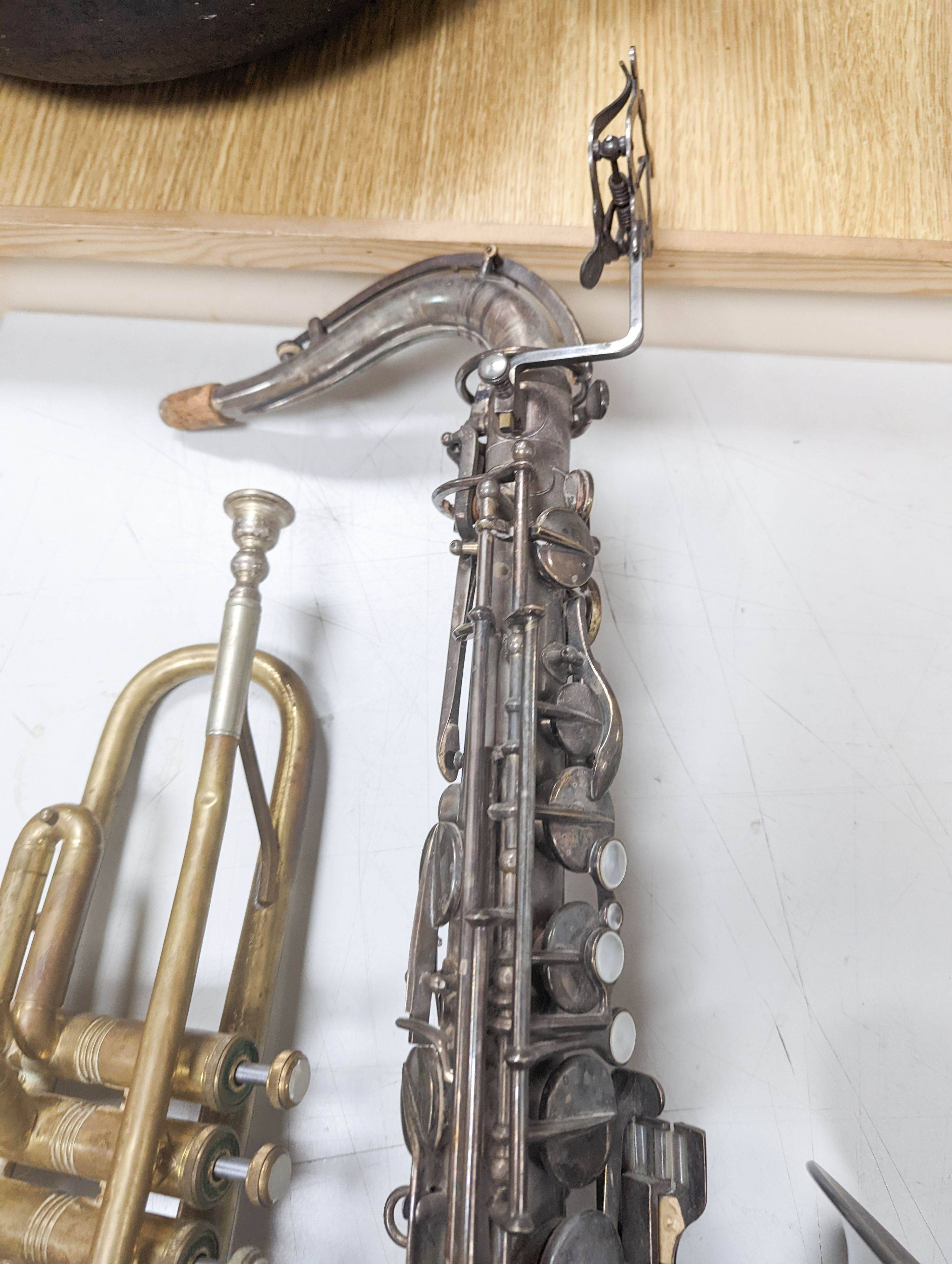 An Excelsior sonorous class A Hawkes & Son saxophone, and a Grafton Dallas, London trumpet with accessories